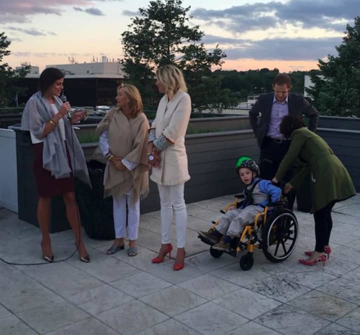 From left: Brooke Bohnsack, Gina Filippelli, Julie Rivard and the Wish Family: Sam Buck (Wish Kid), Allyson Buck and Nicholas Buck. Make-A-Wish Connecticut and the Wishes Ball Committee recently hosted &quot;Rose&#x27; on the Rooftop&quot; in Greenwich.