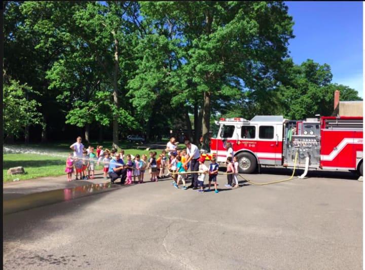 Members of Greenwich Professional Firefighters did fire safety with some kids at the Eastern Greenwich Civic Center as part of safety town.