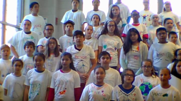 Carlstadt Public School students sing &quot;I&#x27;d like to teach the world to sing.&quot;