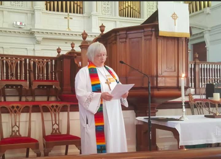 The Rev. Pat Kriss, Pastor of the First Congregational Church of Danbury, gives a welcome and invocation at the Interfaith Vigil for the victims of the Orlando shooting.