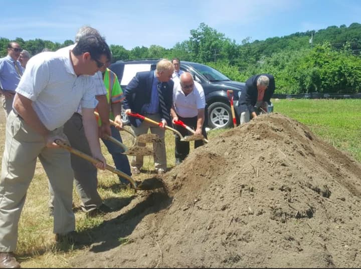 Mayor Mark Boughton and city officials break ground for Danbury&#x27;s first unleashed dog park.