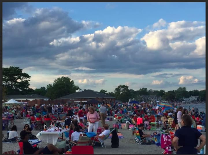 Compo Beach is filled on a perfect evening for fireworks in Westport.
