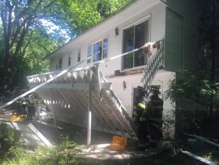 Four people were injured Monday when this deck collapsed during a Fourth of July celebration.