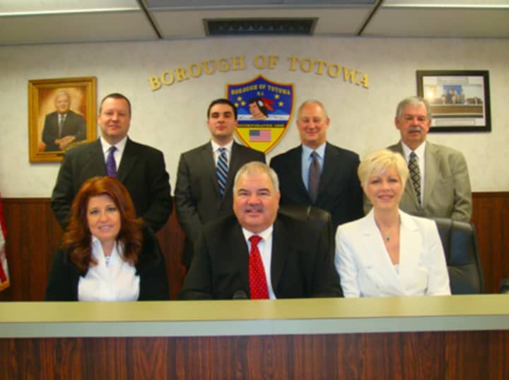 Mayor John Coiro (center) and the Totowa Borough Council.