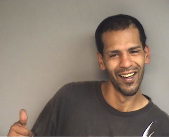 Steven James Ballard, 35, of 102 Holcomb Ave., gives a &quot;thumbs up&quot; to police taking his mug shot after he was arrested on a charge of criminal trespassing Wednesday afternoon.