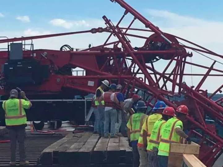 Construction workers investigate the collapse of a crane at the Tappan Zee Bridge on Tuesday.