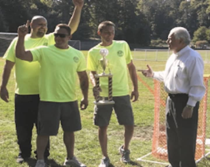 Fairfield First Selectman Michael Tetreau congratulates the Department of Public Works, which won the 2014 Town of Fairfield Wiffle Ball Tournament.