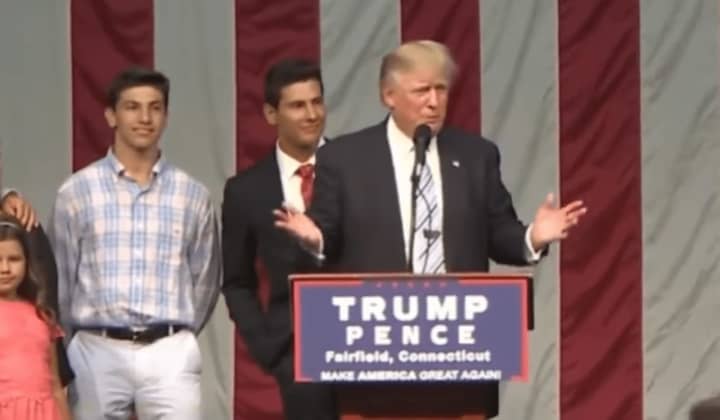 Donald Trump started his rally Saturday night by inviting an 18-year-old from Fairfield, Giacomo Brancato (center), battling cancer to the stage with his family.