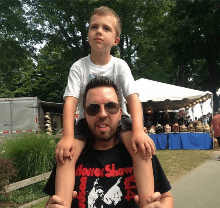Daniel Deyo, a Yorktown native, and his son enjoy the sights and sounds of last year&#x27;s fair.