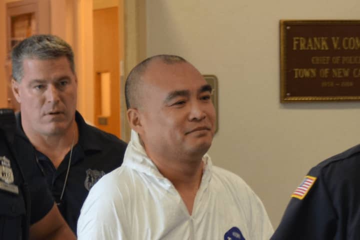 Hengjun Chao, the suspect in Monday&#x27;s shooting at Lange&#x27;s deli in Chappaqua, is escorted by New Castle Police to his arraignment.