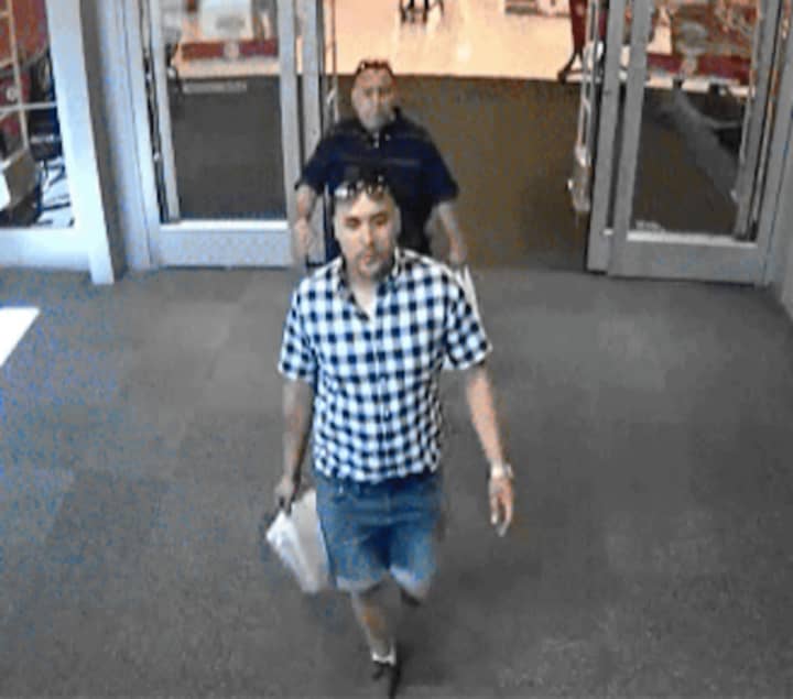 Fairfield police released this photo of two men suspected of stealing credit cards at Trader Joe&#x27;s in Fairfield and using them at Target in Trumbull.