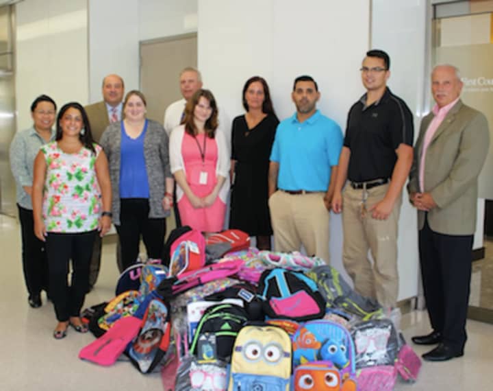 First County Bank employees donate school supplies.