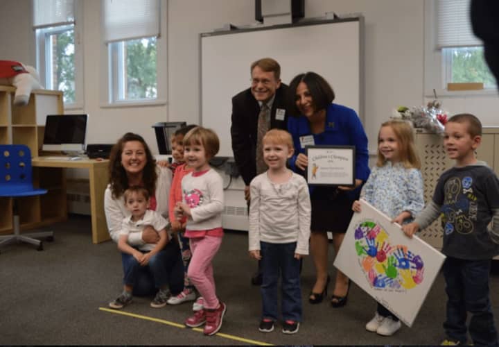 State Sen. Toni Boucher and Merrill Gay, executive director of the Connecticut Early Childhood Alliance, along with children from the Regional YMCA of Western Connecticut Children&#x27;s Center in Bethel.