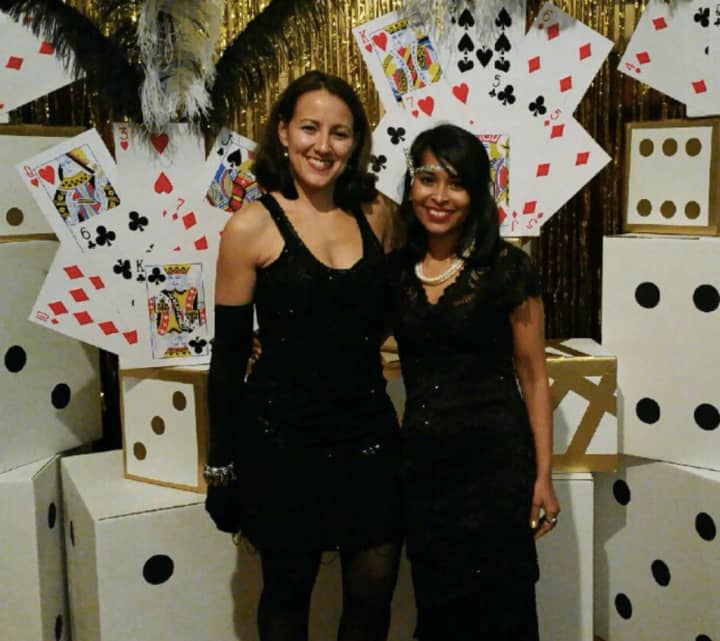 Evannie Ramos, left, and Shehrina Tabassum of Leonia at as flappers during a speakeasy fundraiser they planned for a local school.