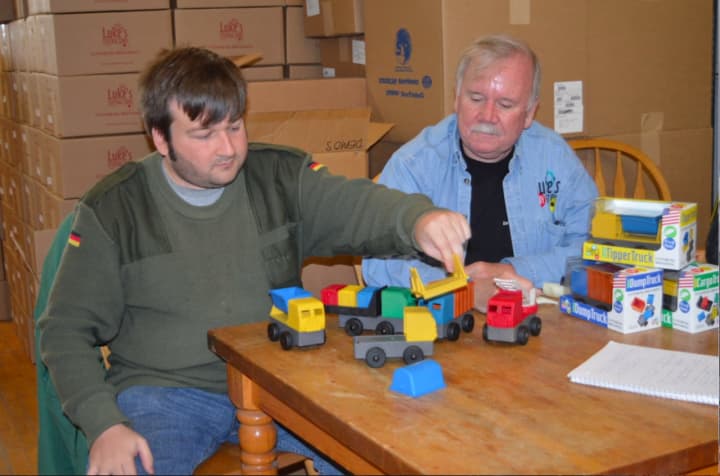 Luke and Jim Barber, of Luke&#x27;s Toy Factory in Danbury, showing their line of toy trucks