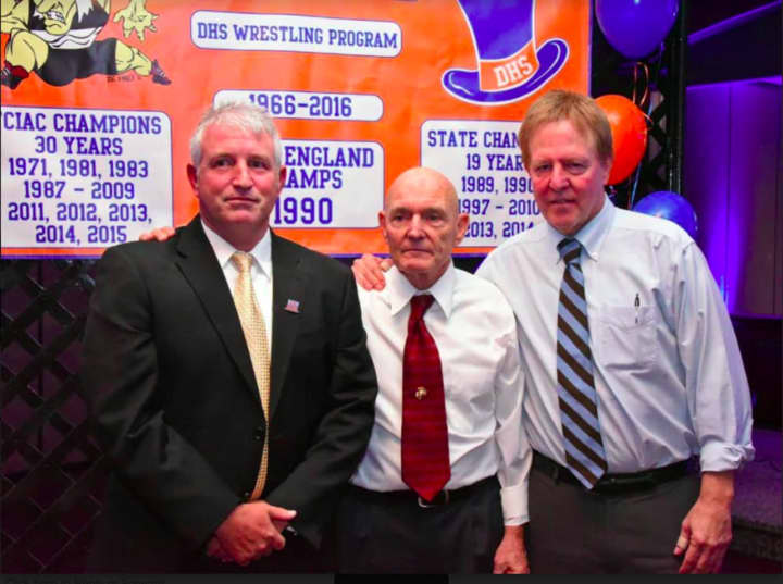 From left, Danbury High School Wrestling Coach Ricky Shook, Former Danbury High School Wrestling Coach Michael Morris, and John Nimock, Former Danbury High School Wrestling Coach