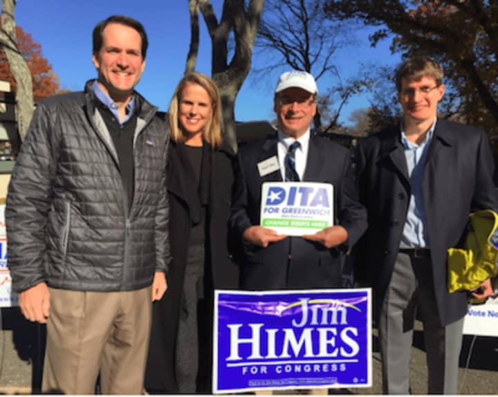 U.S. Rep. Jim Himes, at left, with his wife Mary, supporter Peter Berg and at right Dan Pelletier, husband of Democratic state Representative candidate Dita Bhargava, outside Central Middle School in Greenwich after casting their ballots.