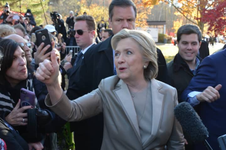 Hillary Clinton gives a thumbs up while meeting with supporters and reporters after she cast her presidential vote in Chappaqua on Nov. 8.