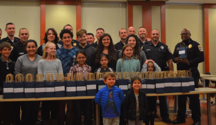Members of the Danbury Police Department received 150 care packages from children in the Greek Orthodox Youth Association (G.O.Y.A.) to recognize National Make A Difference Day