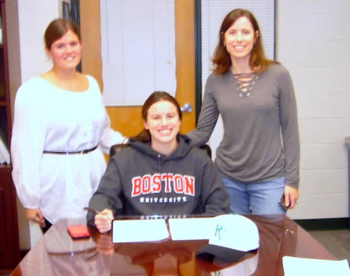 Cassidy Freeman (center), a member of the PVHS Class of 2017, signs a letter of intent to swim for Boston University. Joining Cassie at the signing were Courtney Farrell (left), PVHS assistant swim team coach, and Cassie’s mother, Cynthia Freeman.