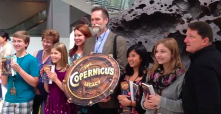 Trumbull resident and children&#x27;s author Tony Abbott, center, will be among the panelists at a children&#x27;s book conference at Fairfield Public Library in December. His latest adventure series, is &quot;The Copernicus Legacy.&quot;
