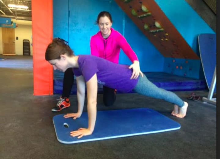 Bridgeport resident Laura Obringer is coached by Michaela Hastings in her Danbury gym