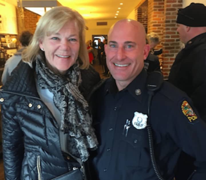 Carol Swift with Officer Jason Levy at Coffee with a Cop in Greenwich Tuesday.