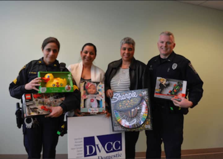 Members of the Norwalk Department of Police Service delivered numerous gifts to the Domestic Violence Crisis Center.