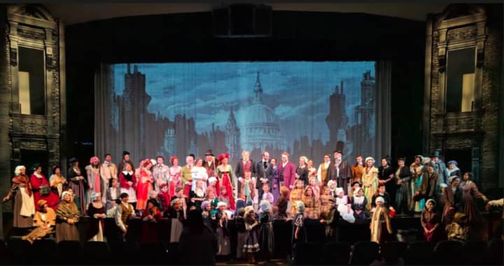 The cast of &quot;A Christmas Carol&quot; with Broadway actor James Ludwig as Scrooge, at the end of a dress rehearsal at Walnut Hill Community Church in Bethel.