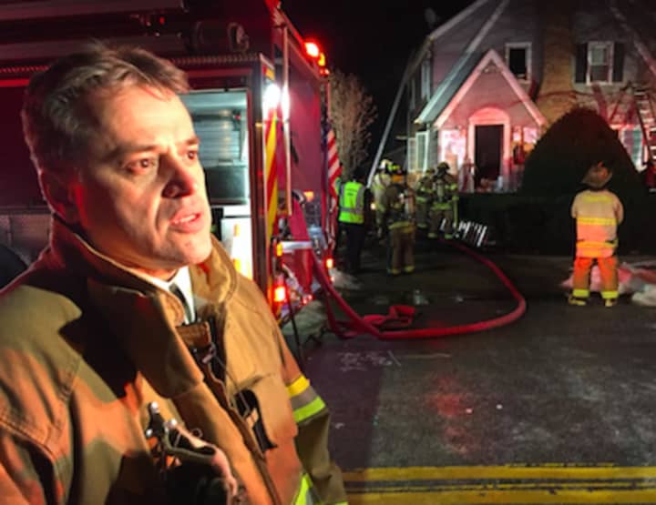 Assistant Chief Mike Robles speaking at scene of fire at 26 Underhill St., in Stamford early Wednesday evening.