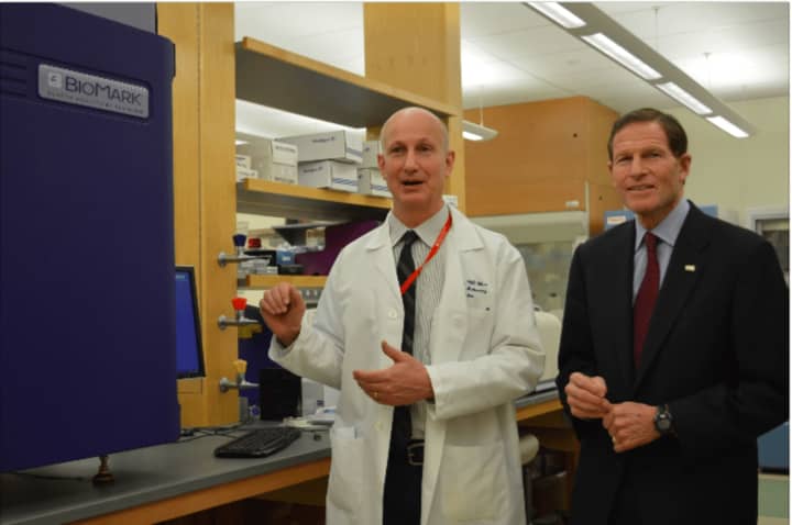 Dr. Paul Fiedler shows U.S. Sen. Richard Blumenthal the research for Lyme disease detection that is taking place at the Western Connecticut Health Network Biomedical Research Institute in Danbury.
