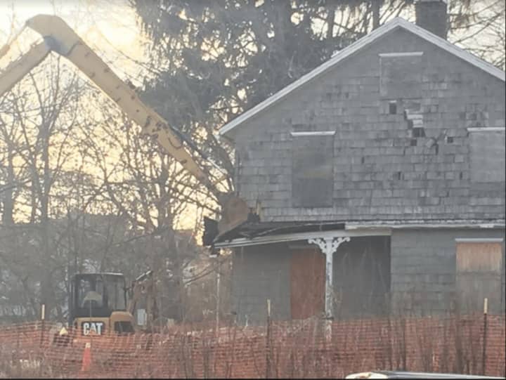 Demolition began on Thursday to raze the empty house on 28 Catoonah St. in Ridgefield.   According to Ridgefield First Selectman Rudy Marconi, there are plans to build a pocket park in its place.