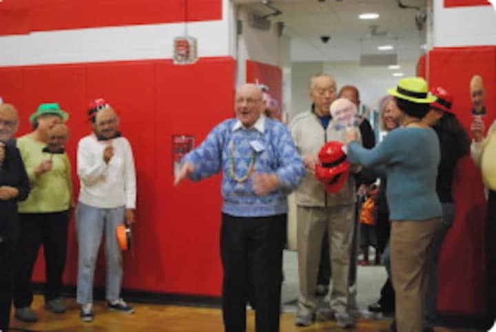Dante Chicatell, 103, works part-time at the New Canaan YMCA. He is shown here at a Y birthday bash when he turned 100.
