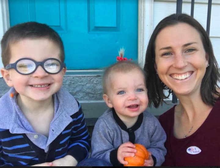Trumbull resident Ashley Gaudiano with her two children on her front steps, taken right after she voted for Sen. Hillary Clinton for president.