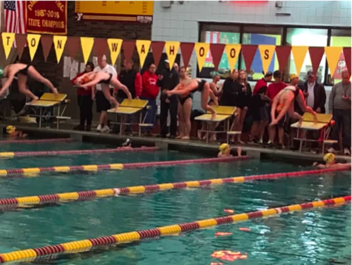 Three Brookfield Y Mako swimmers dive off the starting block for the 200-yard butterfly. The boys won second place at a championship meet in Wilton.