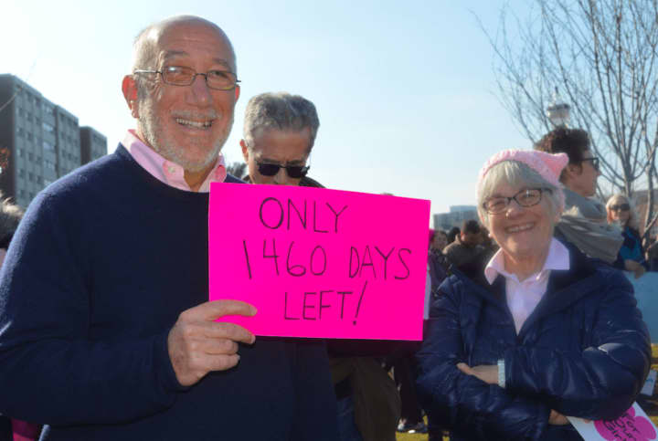Westport residents Stanley and Susan Witkow hold up signs at the Women&#x27;s March in Stamford. The organizers of the march are planning &quot;My Favorite President’s Day&quot; Sunday, Feb. 19 at the Ferguson Library.