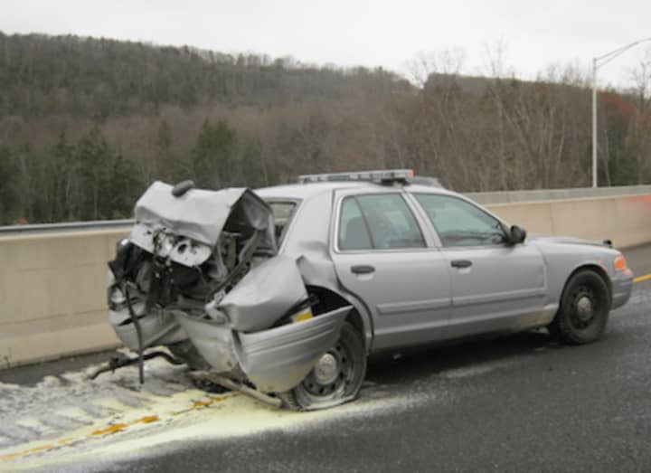 A motorist allegedly slammed into a parked State Police vehicle on Route 7 in Brookfield Monday morning. The driver and trooper were taken to hospital with undetermined injuries.