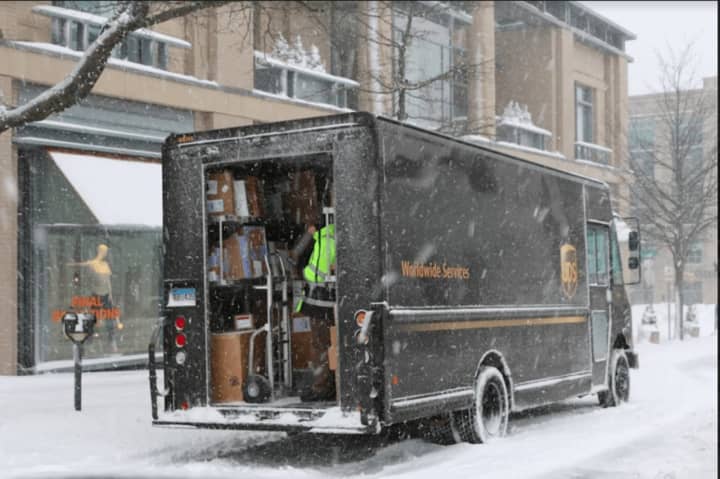 A UPS delivery truck making its way through the snow on Greenwich Avenue during Thursday&#x27;s snowstorm