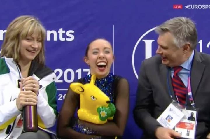 Redding&#x27;s Brooklee Han, center, celebrates with coaches Darlene and Peter Cain after her free skate at the Four Continent Championships on Sunday.