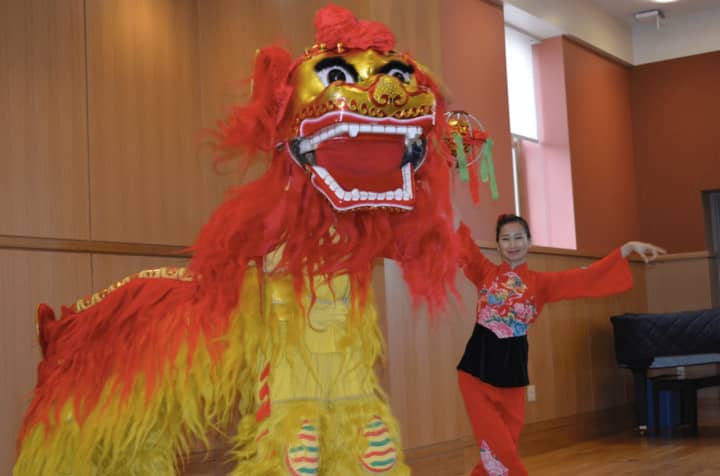 The lion is part of the Chinese Lion Dance program, which came to the Darien Library on Tuesday.