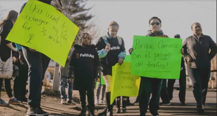 Families staged a protest walk Friday against proposed school busing changes in Bridgeport.