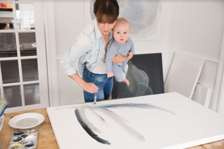 Artist Bethany Brooke of Westport sometimes paints with her young son Nick.