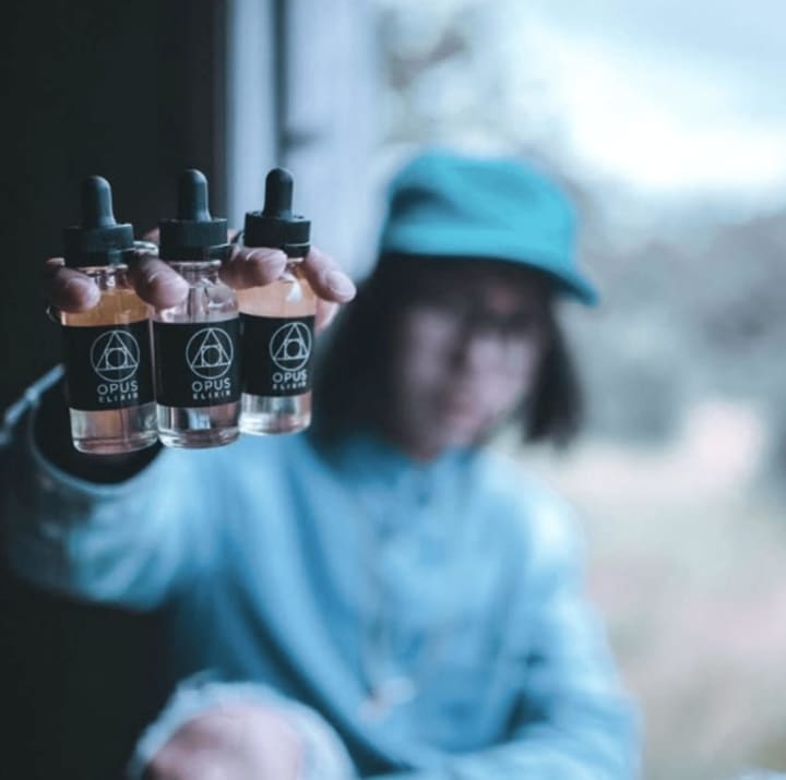 Vaping has exploded in popularity in the past few years. Here a customer holds up vaping liquids.