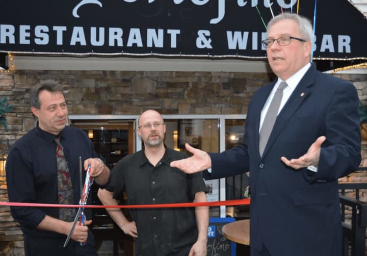Bethel First Selectman Matthew Knickerbocker speaks with Louie and Rocko Selmanti, owners of Portofino Restaurant &amp; Bar in Bethel.  The restaurant is back in business after being closed for a year.