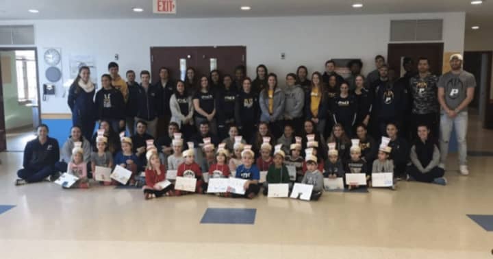 Dozens of Pace University student-athletes visited elementary school students in celebration of National Read Across America Day and Vocabulary Day.