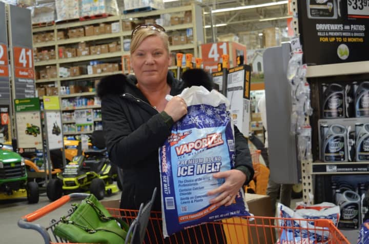 Alicia Pagel of New Milford was stocking up on items for the snow at Home Depot on Federal Road in Danbury, in preparation for the impending blizzard that&#x27;s expected on Tuesday.