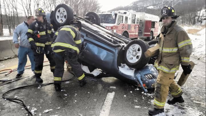 Emergency responders at the scene of the Route 17 crash involving an overturned vehicle Sunday morning.