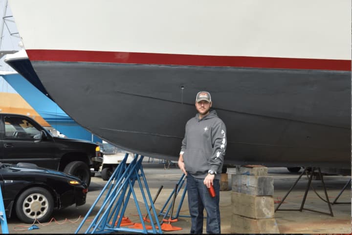 Captain John Trimbach of Nautical Solutions in Norwalk gets boats ready for his clients.