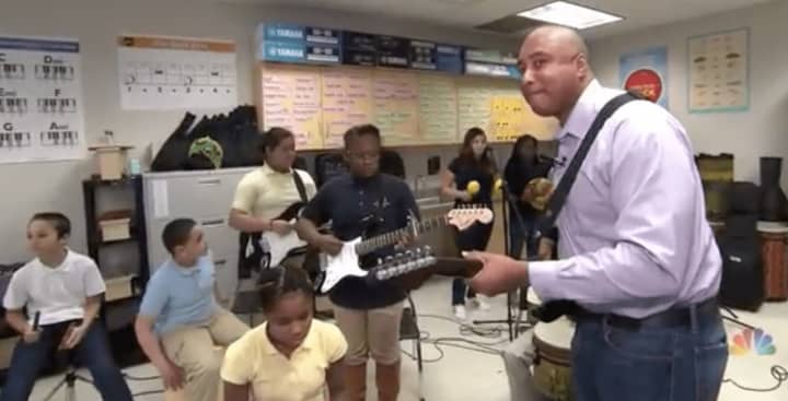 Former New York Yankee Bernie Williams jams with students at Jettie S. Tisdale School in Bridgeport during a segment on NBC Nightly News.