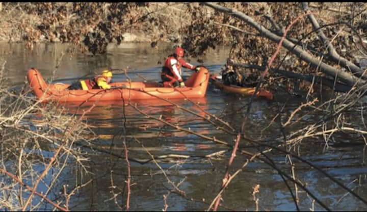 A kayak became pinned against a tree amid swift-moving water and strong winds at the center of Wappinger Creek in the Town of Poughkeepsie on Saturday.